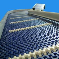 Stainless Steel Modular Belt Conveyor with flights on an incline